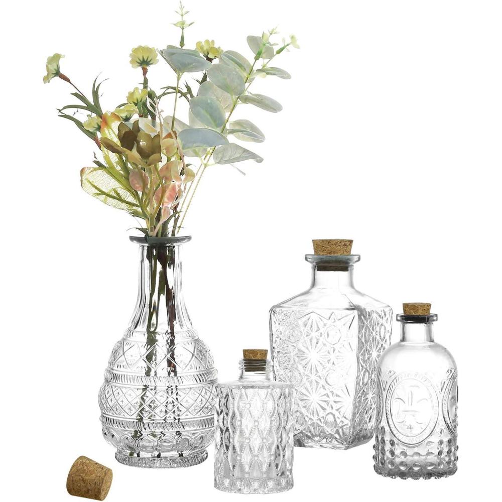imageMyGift Small Clear Glass Reed Diffuser Bottles Vintage Embossed Apothecary Style Flower Bud Vases with Cork Lids Assorted Design and Sizes Set of 4
