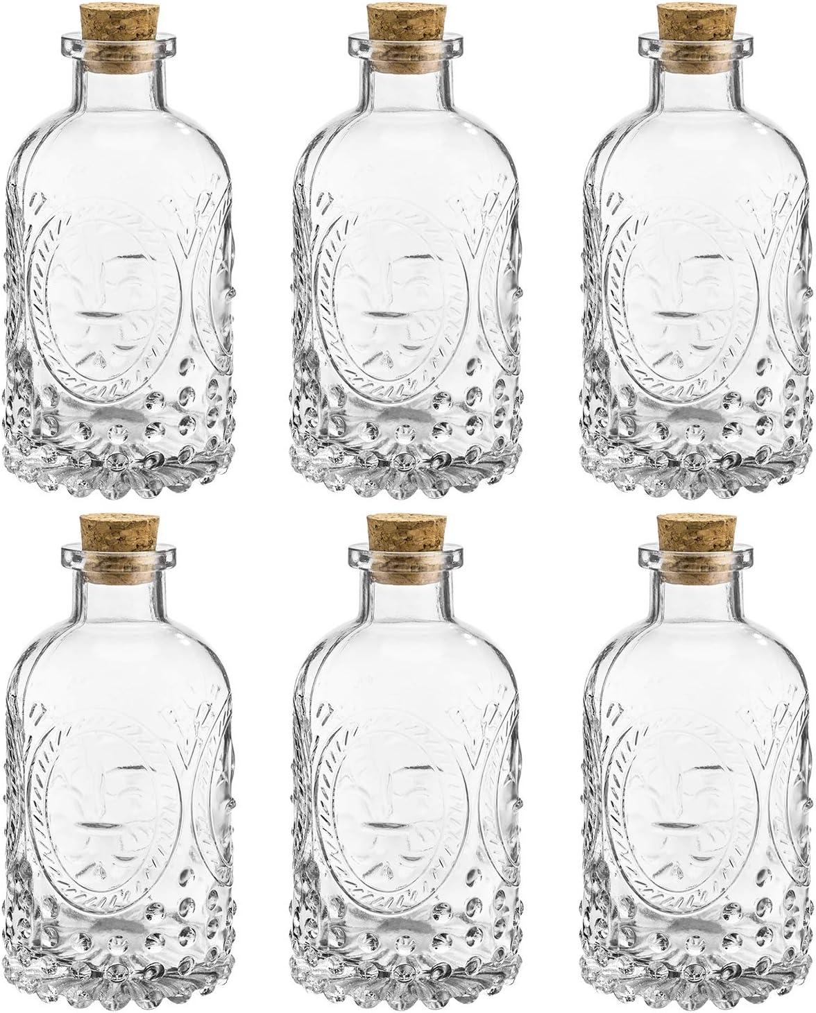 imageMyGift Small Clear Glass Reed Diffuser Bottles Vintage Embossed Apothecary Style Flower Bud Vases with Cork Lids Set of 2Vintage Clear Glass Set of 6